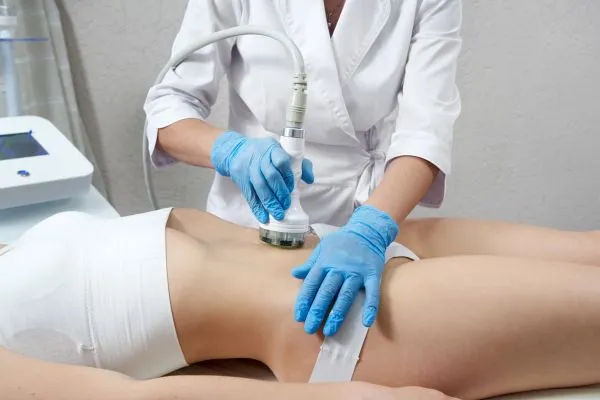 Lost the Weight but Not the Loose Skin? 2 woman having HIFU treatment on her stomach to combat loose skin Coombe following weight loss